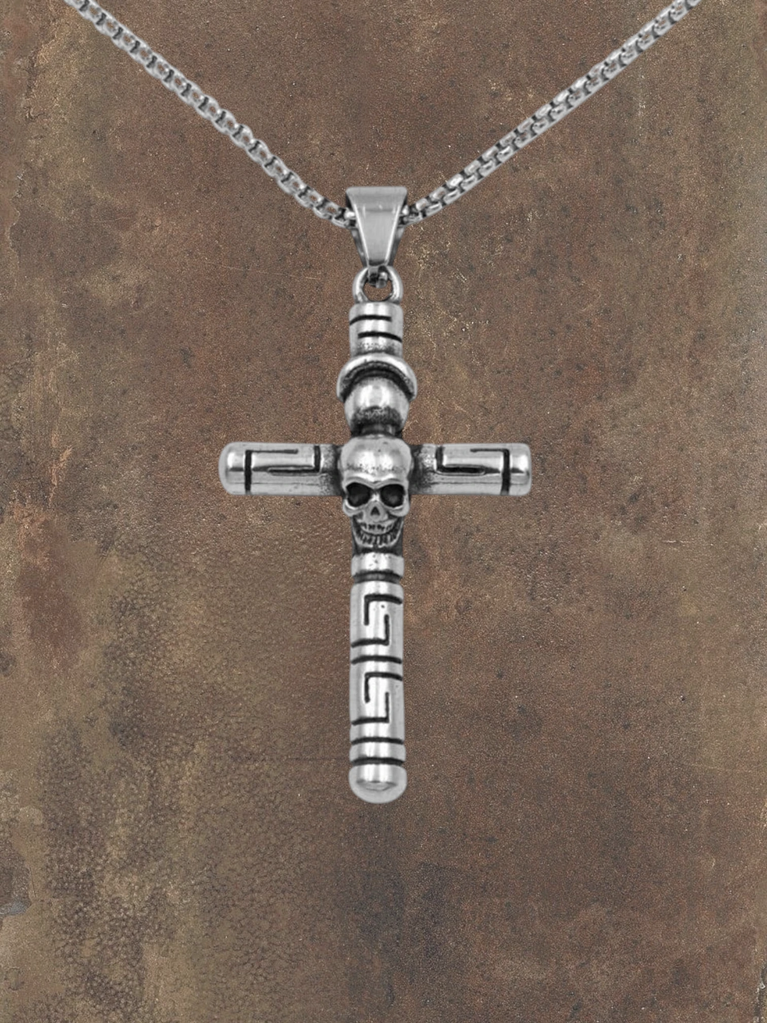 WILDSIDE silver stainless steel cross pendant with skull detail and Greek key design. Hand-polished.