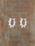 WILDSIDE silver-tone metal spiked hoop earrings with punk-inspired flair.