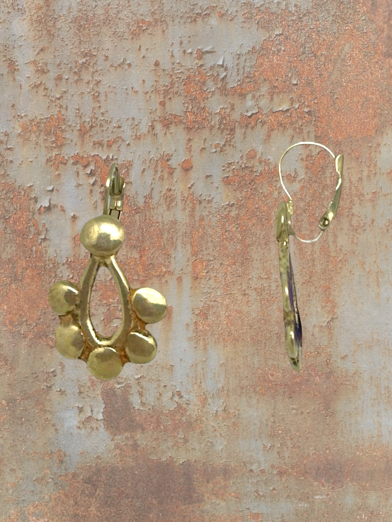 WILDSIDE gold geometric drop earrings with open teardrop and rounded charms, lever-back closure.
