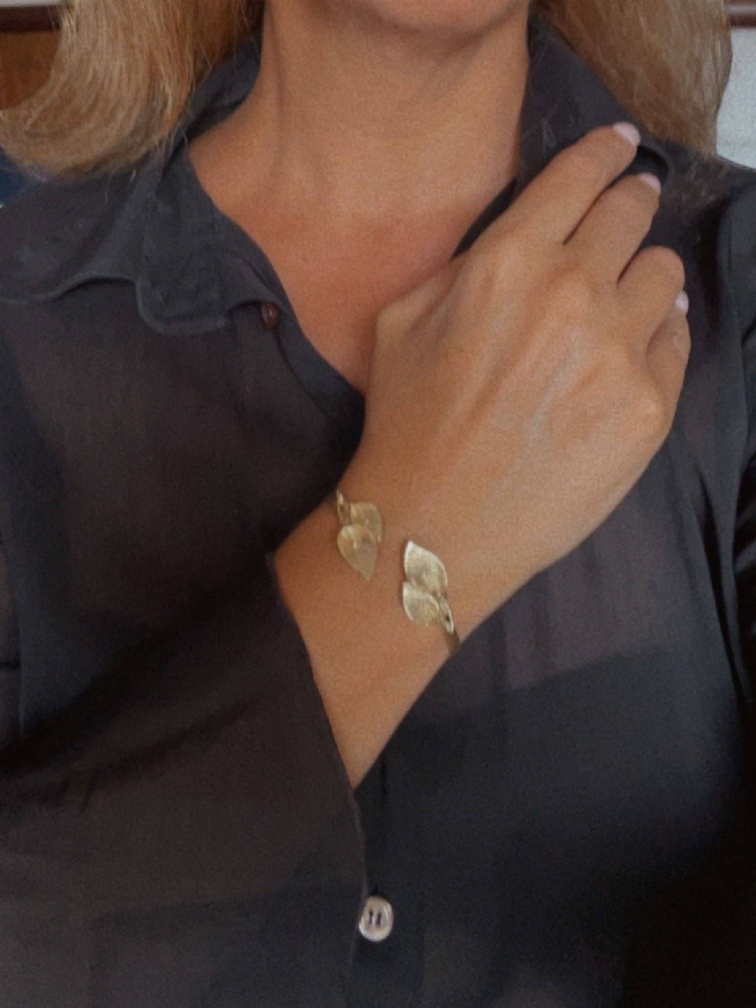 WILDSIDE gold-tone open cuff bracelet with delicate leaf motifs. Elegant botanical jewelry.
