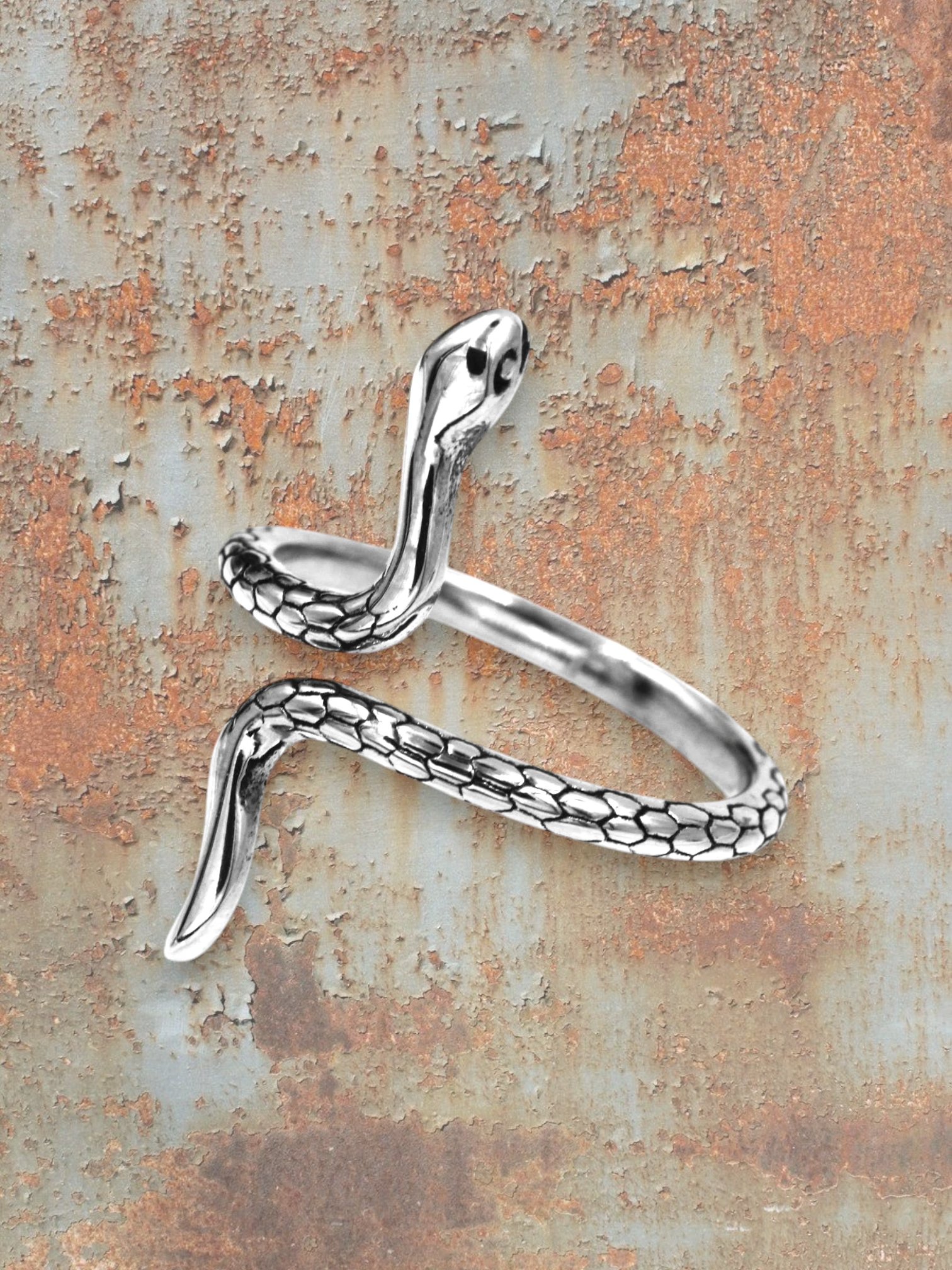 WILDSIDE silver stainless steel snake ring with detailed scales and polished finish.