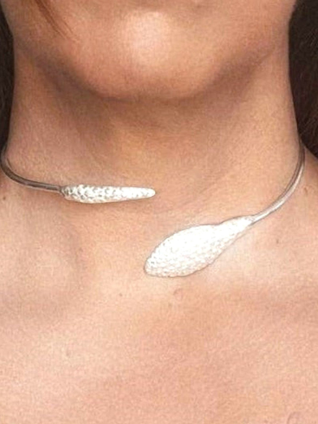 WILDSIDE silver-tone metal sculptural open neck ring with textured pod details. Modern choker style.