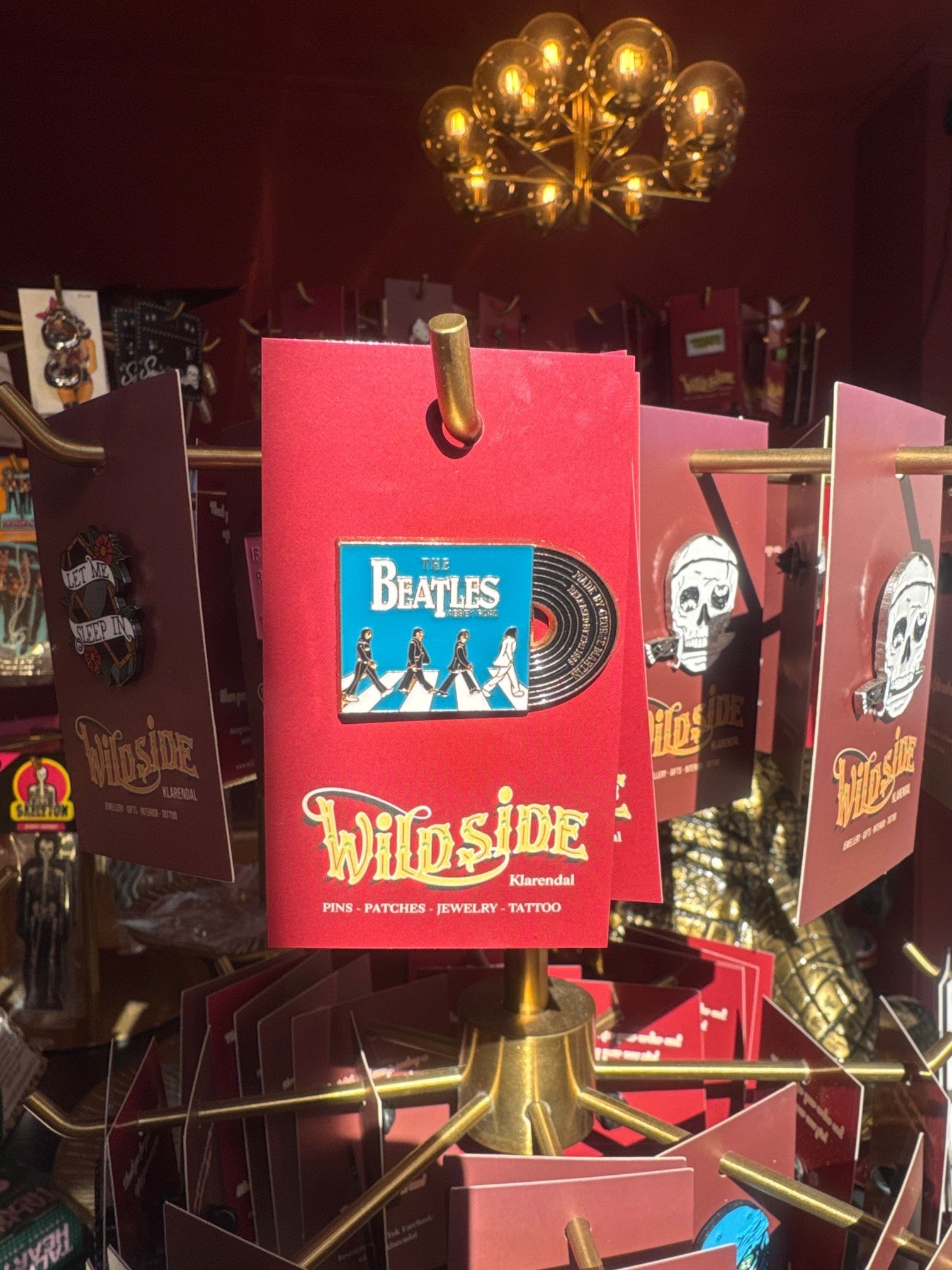 WILDSIDE The Beatles Abbey Road enamel pin featuring the iconic album cover art and miniature record detail.