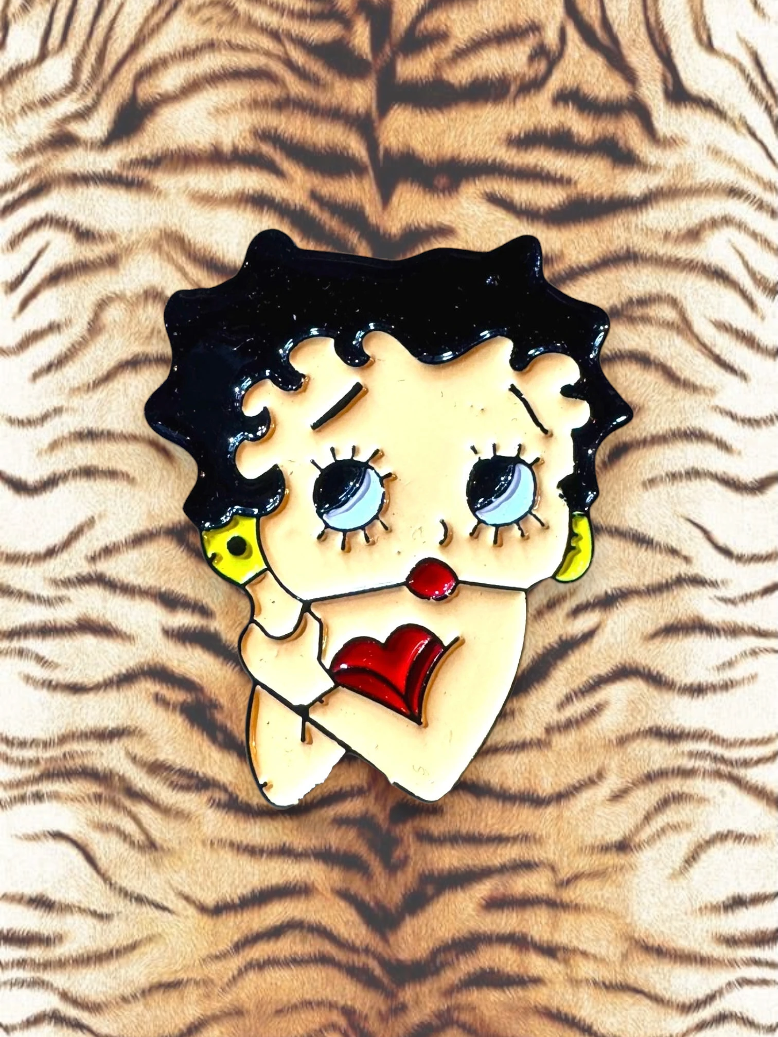 WILDSIDE Betty Boop enamel pin with black hair, yellow skin, blue eyes, red lips and heart detail.