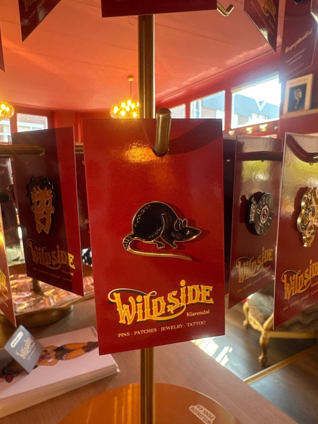 WILDSIDE black enamel rat pin with gold trim, perfect for jackets and bags.