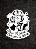 WILDSIDE black and white pin featuring a crying woman reading a book and holding a coffee mug, with text "Born to Read Forced To Work".
