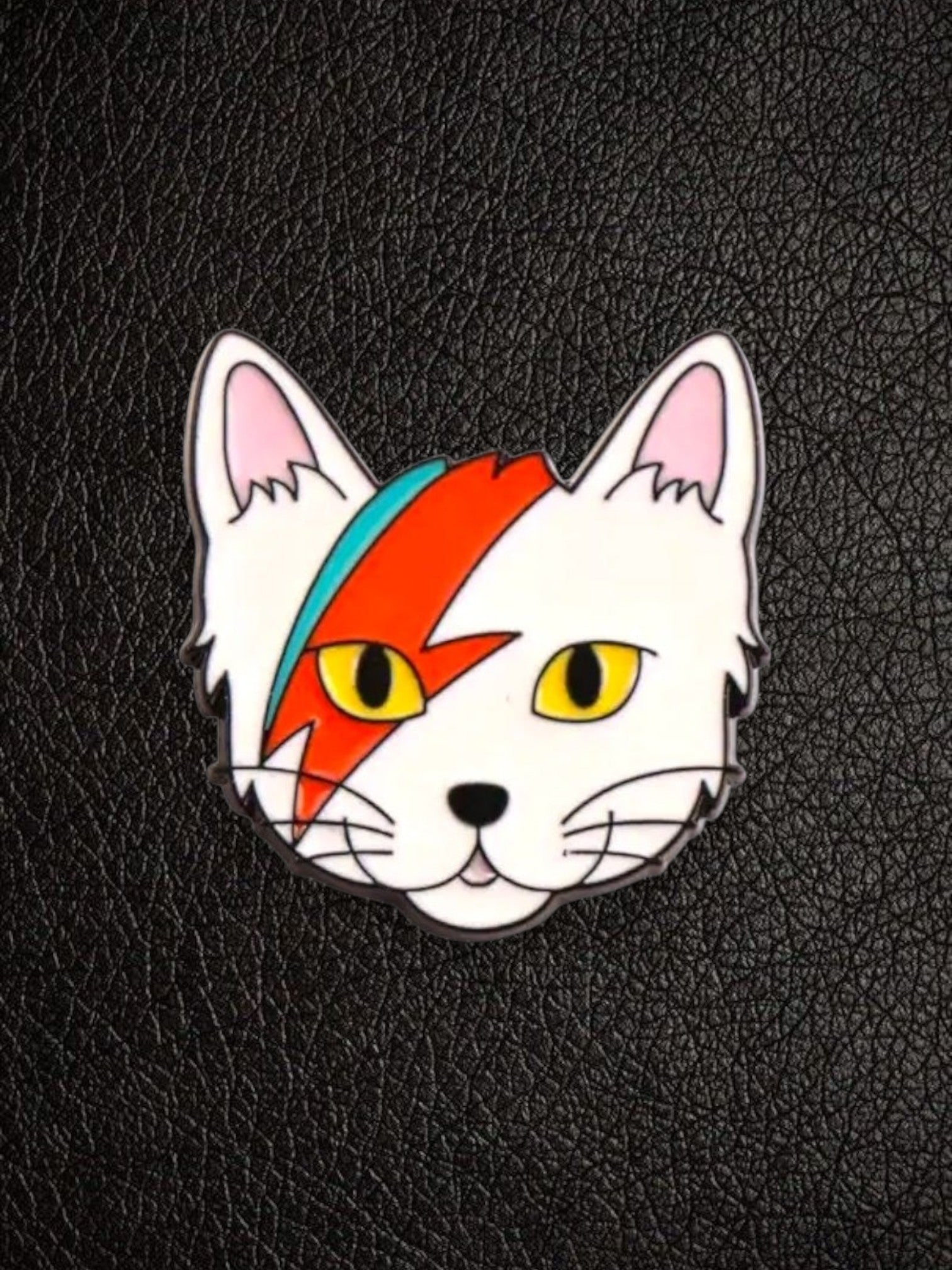 WILDSIDE white cat pin with David Bowie lightning bolt makeup and yellow eyes