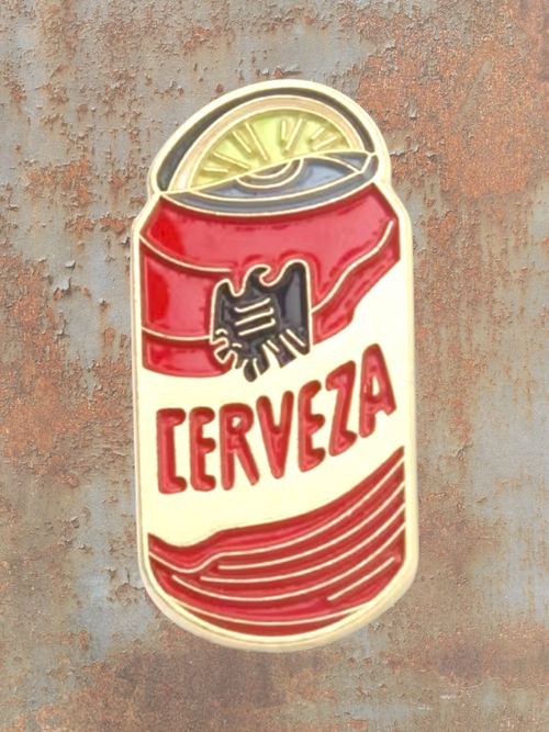 WILDSIDE Cerveza beer can enamel pin with a lime slice on top. Red and yellow design.