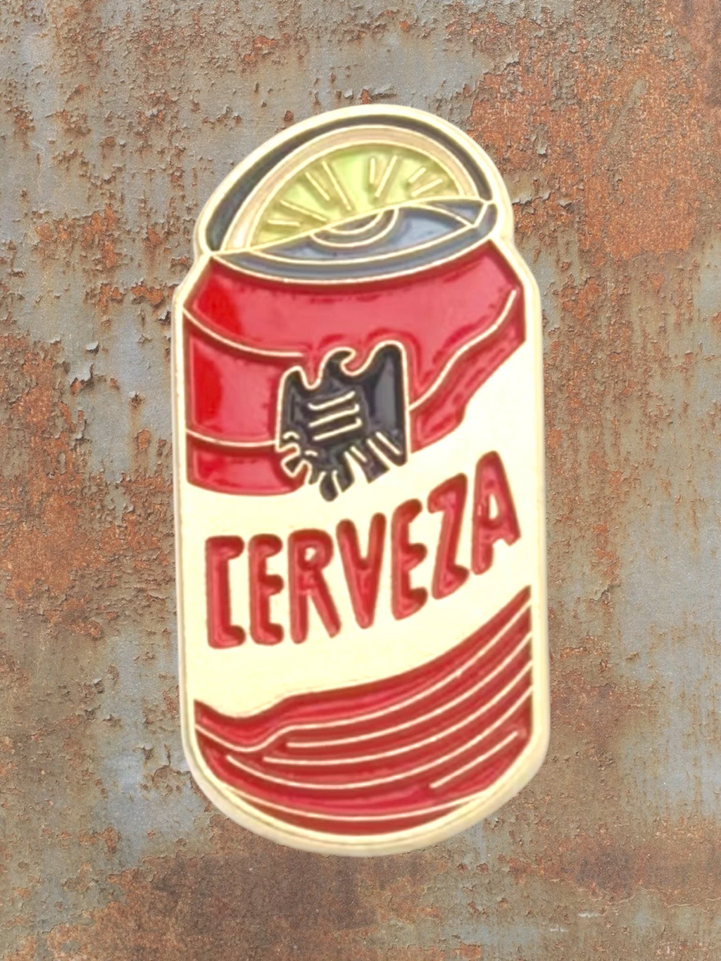 WILDSIDE Cerveza beer can enamel pin with a lime slice on top. Red and yellow design.
