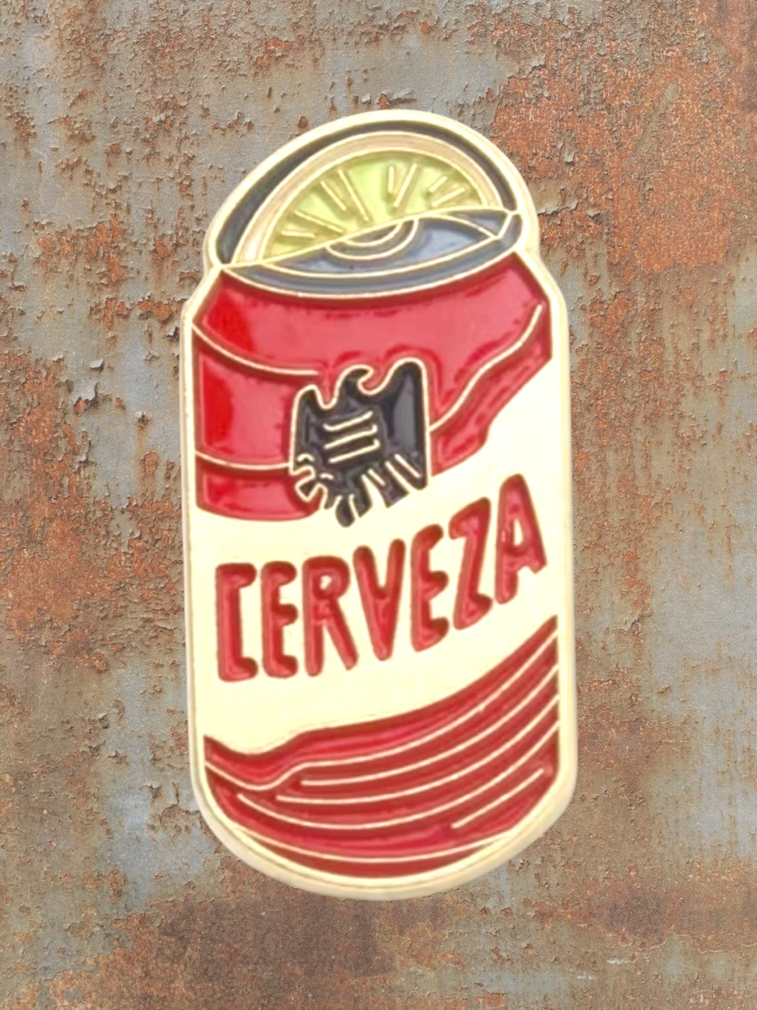 WILDSIDE Cerveza beer can enamel pin with a lime slice on top. Red and yellow design.