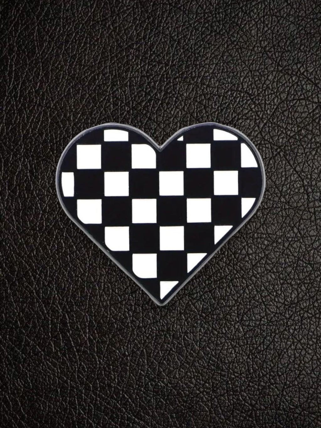 WILDSIDE checkerboard heart pin with black and white squares, perfect for jackets and bags.