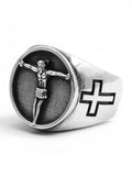 WILDSIDE silver-tone signet ring featuring a detailed crucifix centerpiece on a textured background with side cross motifs.