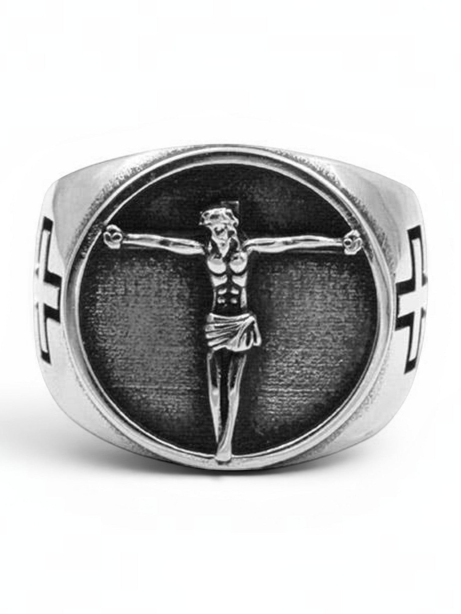 WILDSIDE silver-tone signet ring featuring a detailed crucifix centerpiece on a textured background with side crosses.