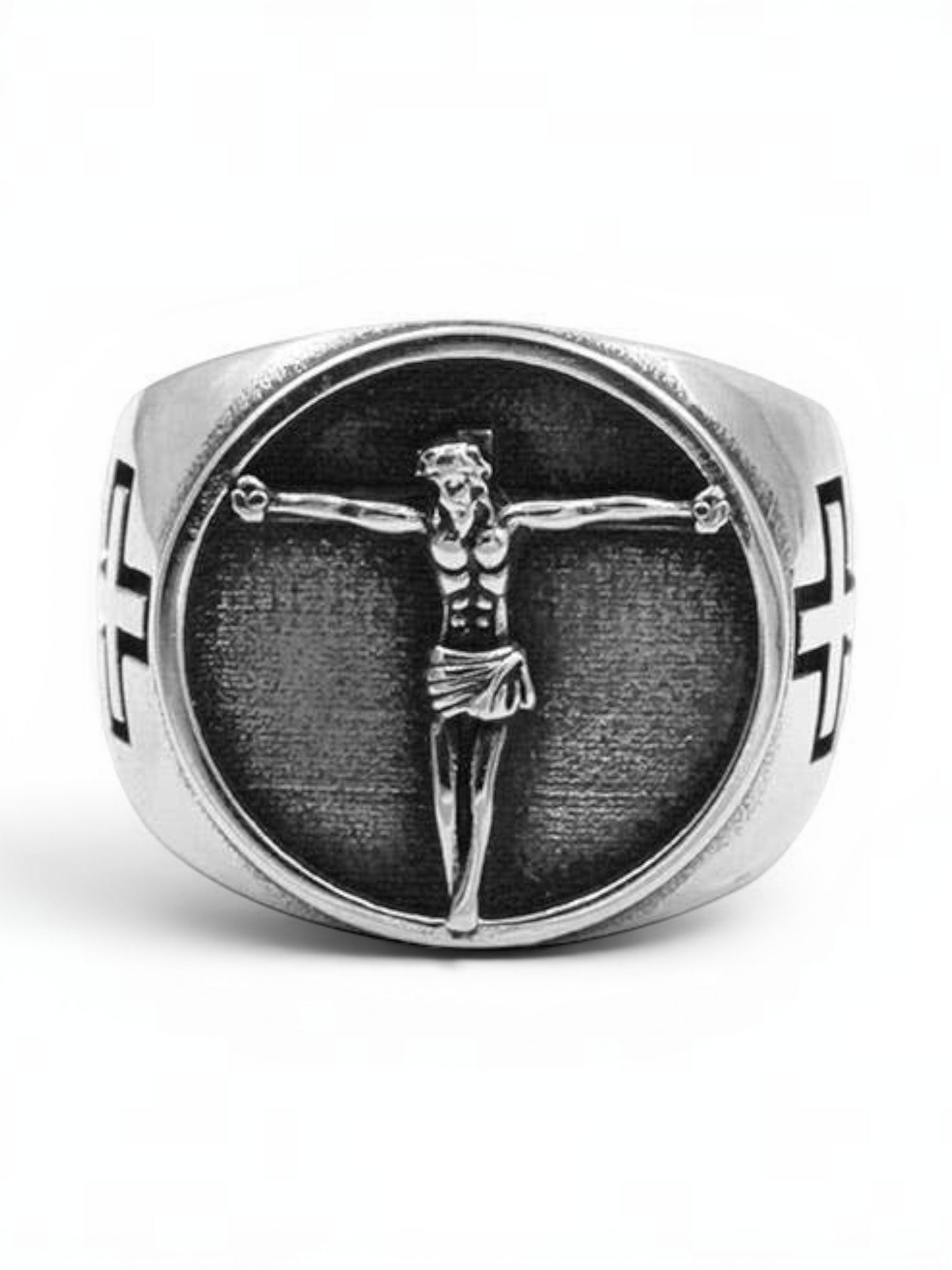 WILDSIDE silver-tone signet ring featuring a detailed crucifix centerpiece on a textured background with side crosses.