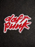 WILDSIDE Daft Punk logo pin with red enamel script on a silver-toned metallic finish.