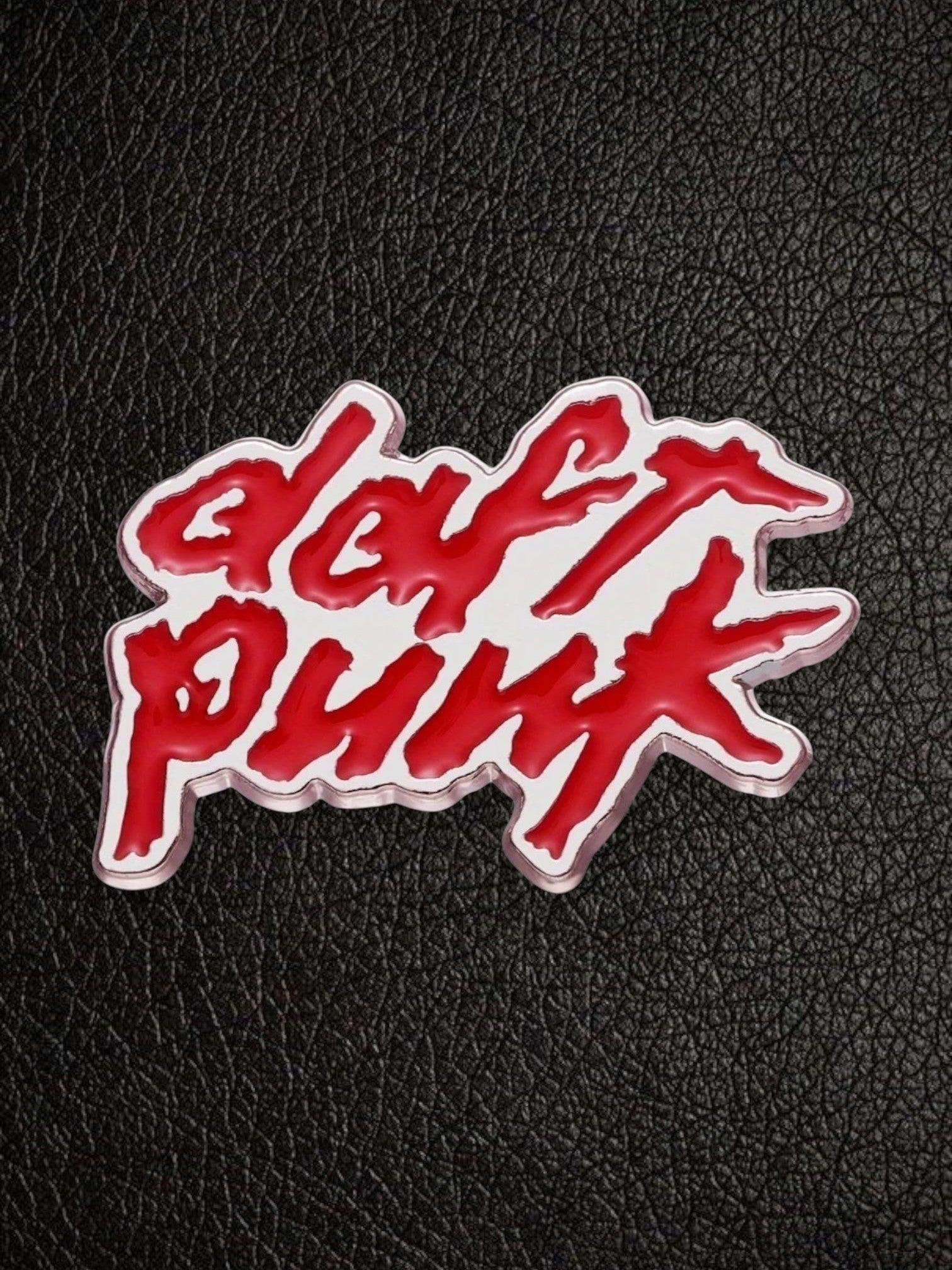 WILDSIDE Daft Punk logo pin with red enamel script on a silver-toned metallic finish.