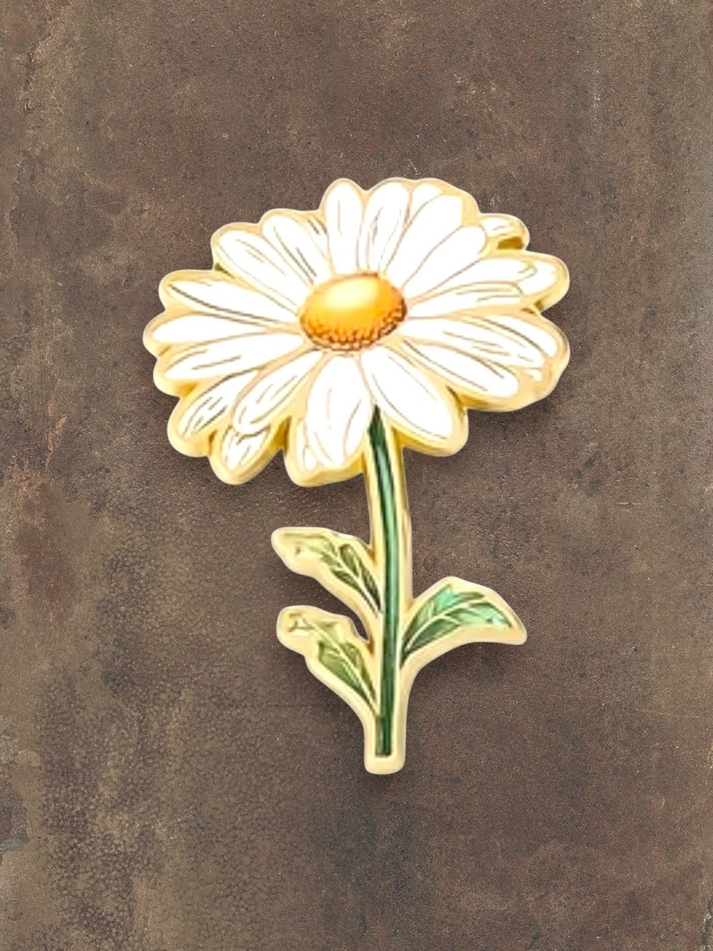 WILDSIDE enamel daisy flower pin with white petals and yellow center, green stem and leaves.