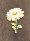 WILDSIDE enamel daisy flower pin with white petals and yellow center, green stem and leaves.