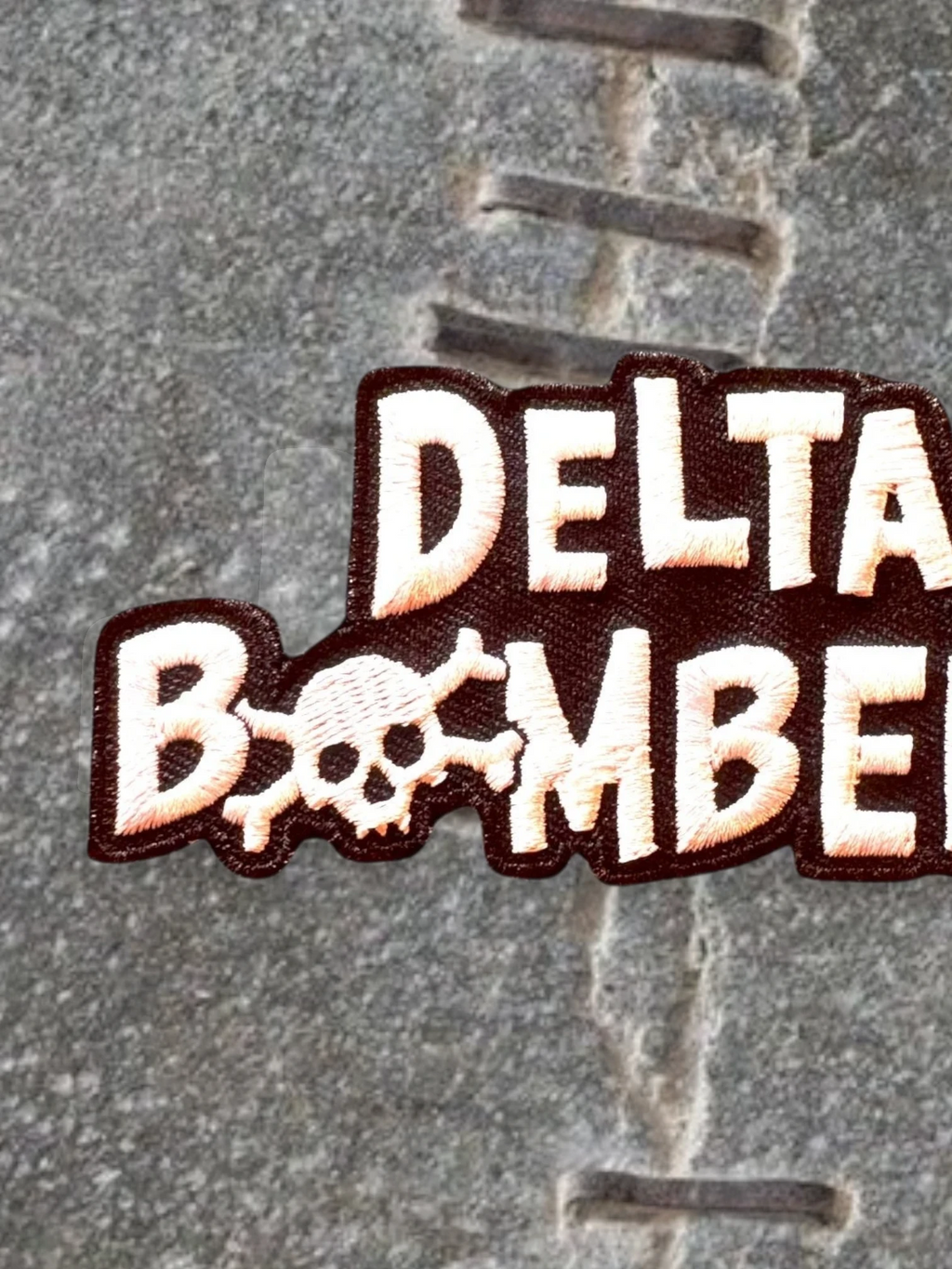 WILDSIDE Delta Bombers embroidered patch with skull detail, white and tan lettering on dark brown.