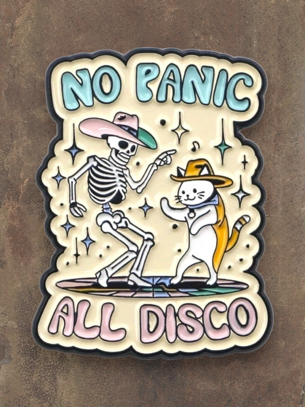 WILDSIDE No Panic All Disco enamel pin featuring a skeleton and cat dancing, both wearing cowboy hats.