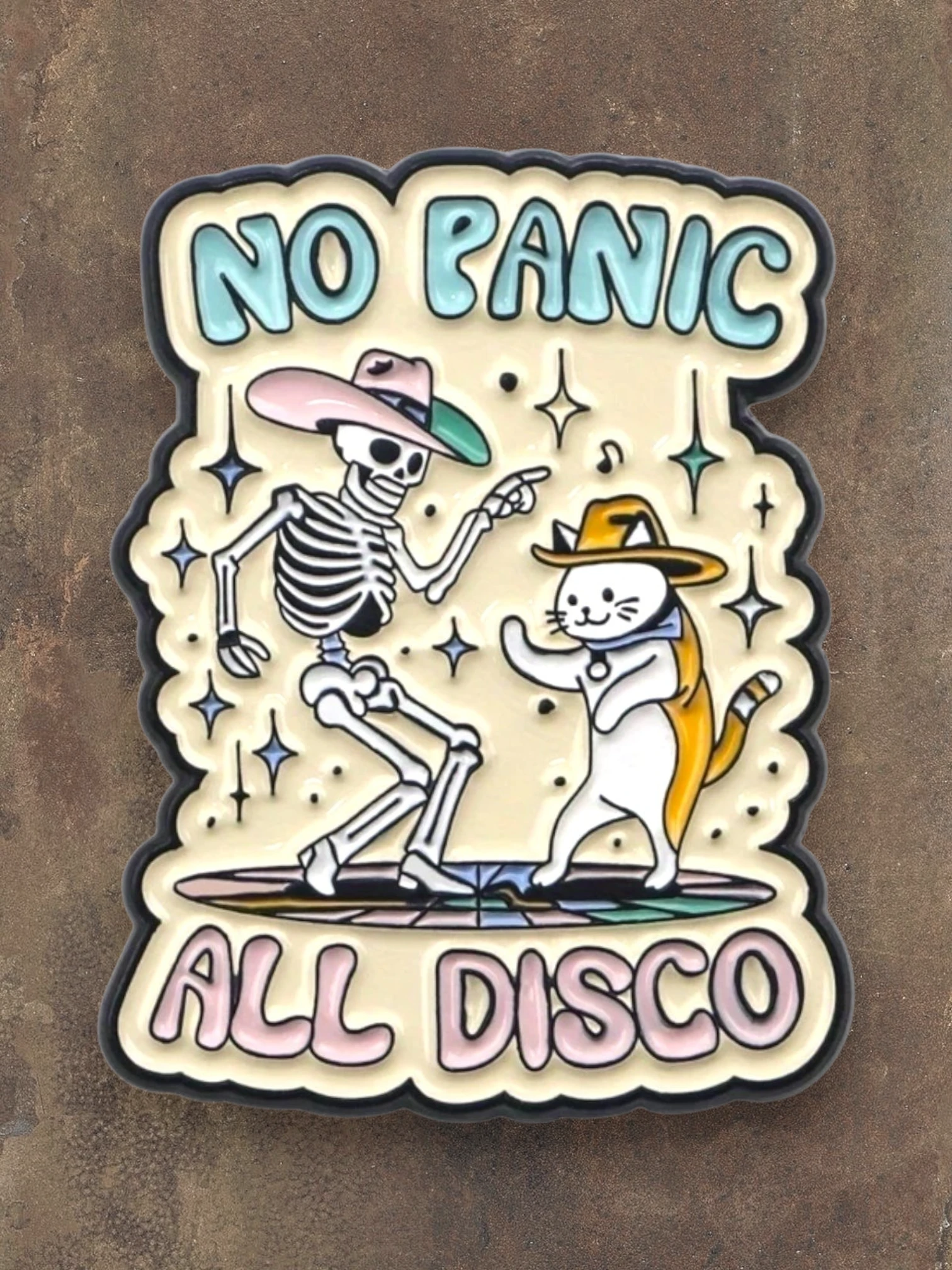 WILDSIDE No Panic All Disco enamel pin featuring a skeleton and cat dancing, both wearing cowboy hats.