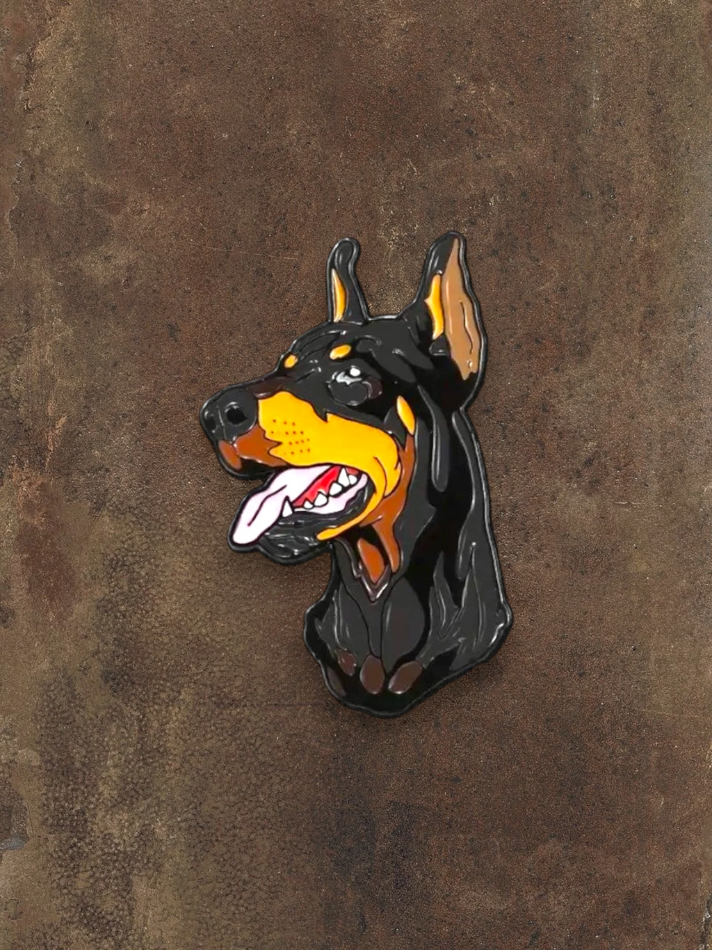 WILDSIDE Doberman dog enamel pin with black, tan, and yellow coloring, featuring a detailed head and tongue.