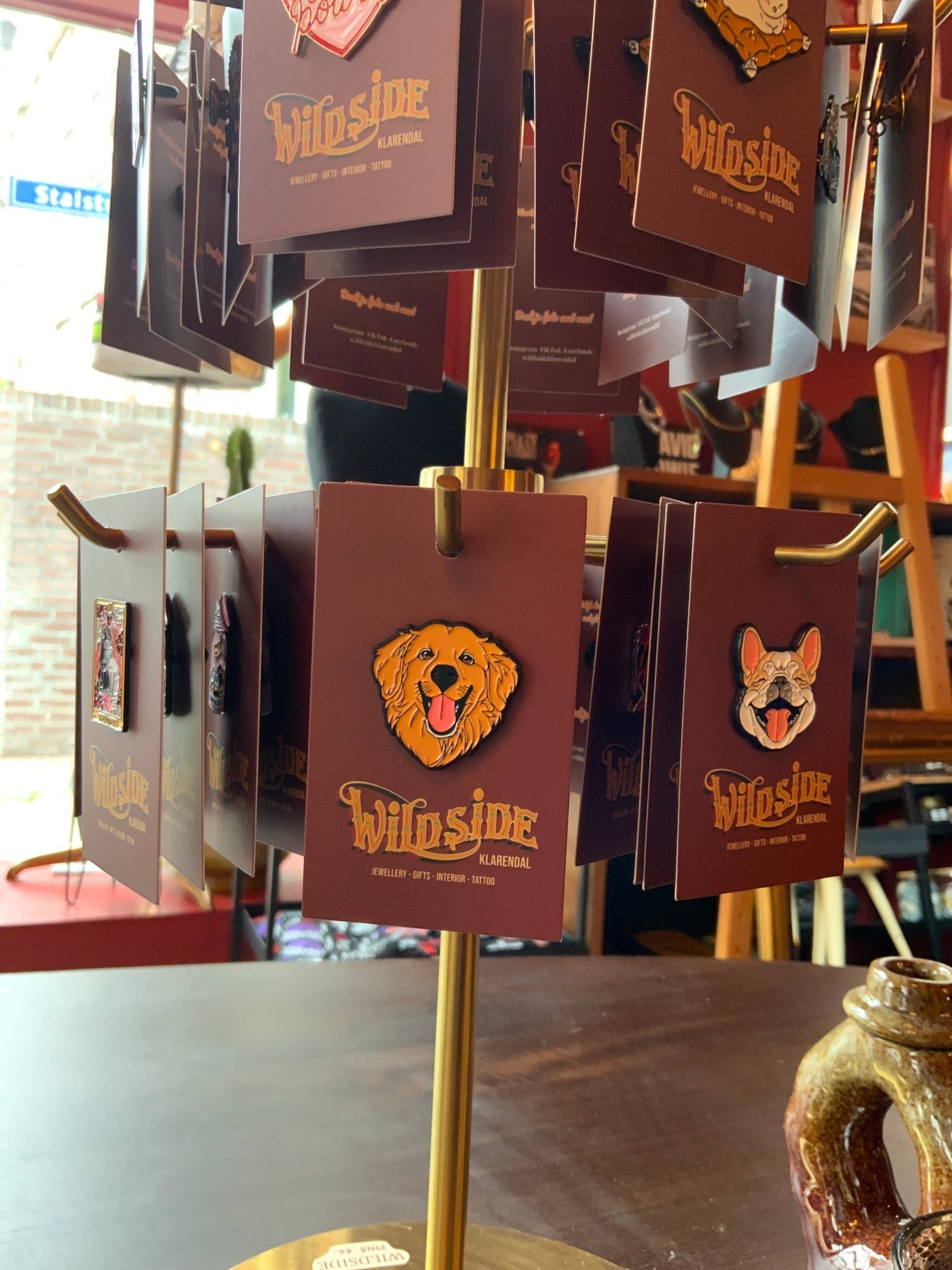 WILDSIDE enamel dog pins featuring a golden retriever and a French bulldog, perfect for jackets and bags.