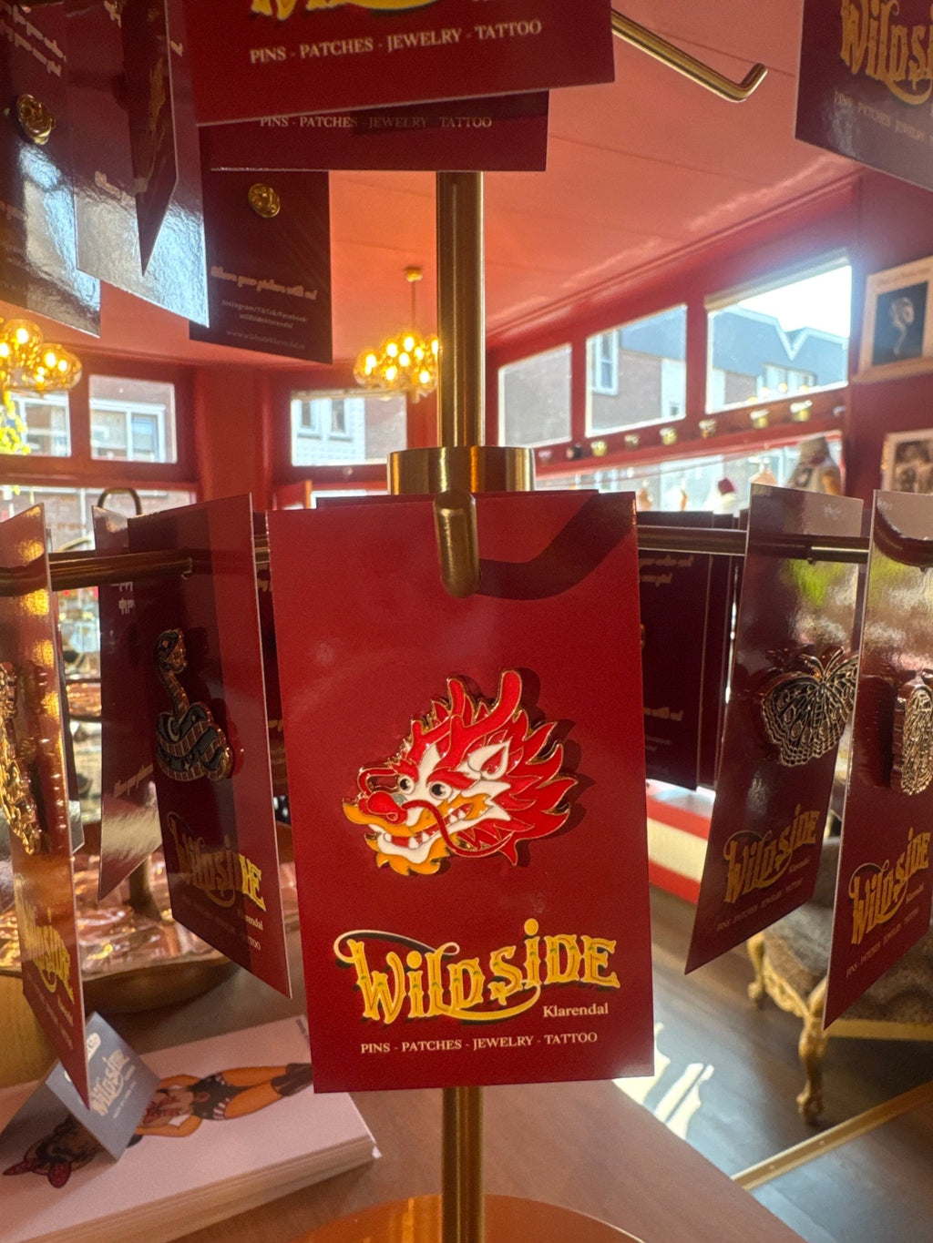 WILDSIDE red and white dragon enamel pin with gold trim. Perfect for jackets and bags.