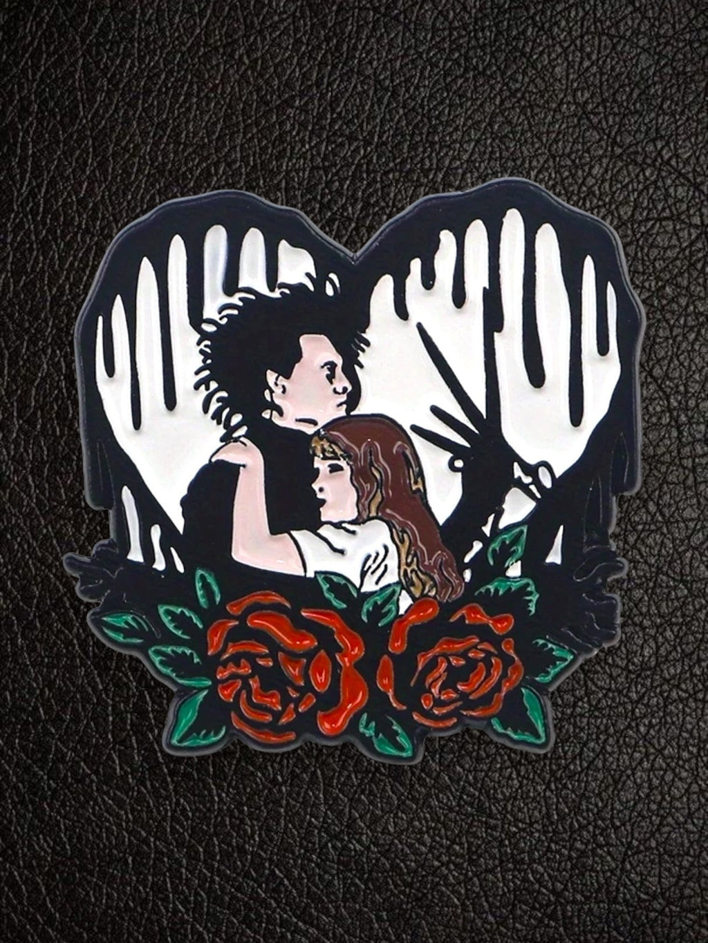 WILDSIDE Edward Scissorhand and Kim Boggs enamel pin with red roses and black dripping heart.
