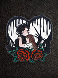 WILDSIDE Edward Scissorhand and Kim Boggs enamel pin with red roses and black dripping heart.