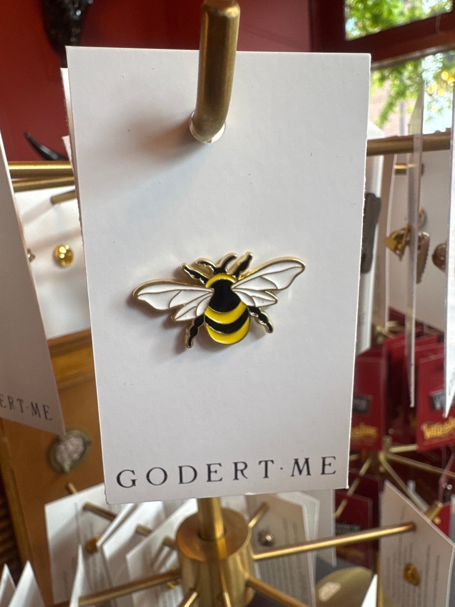 WILDSIDE gold-tone enamel bee lapel pin with black and yellow stripes and white wings.