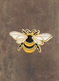 WILDSIDE gold-tone enamel bee lapel pin with black and yellow stripes and white wings.