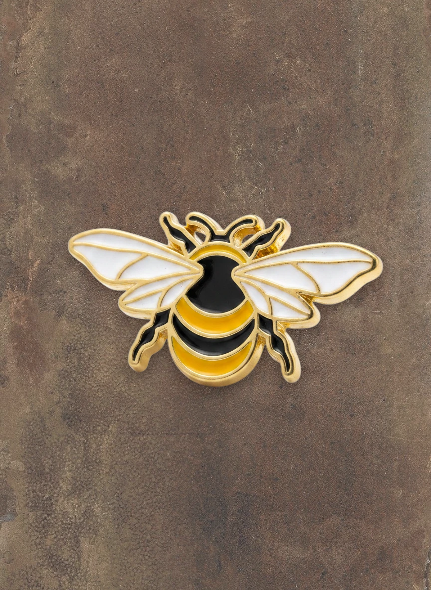 WILDSIDE enamel bee lapel pin with gold-tone finish, black and yellow stripes, and white wings.