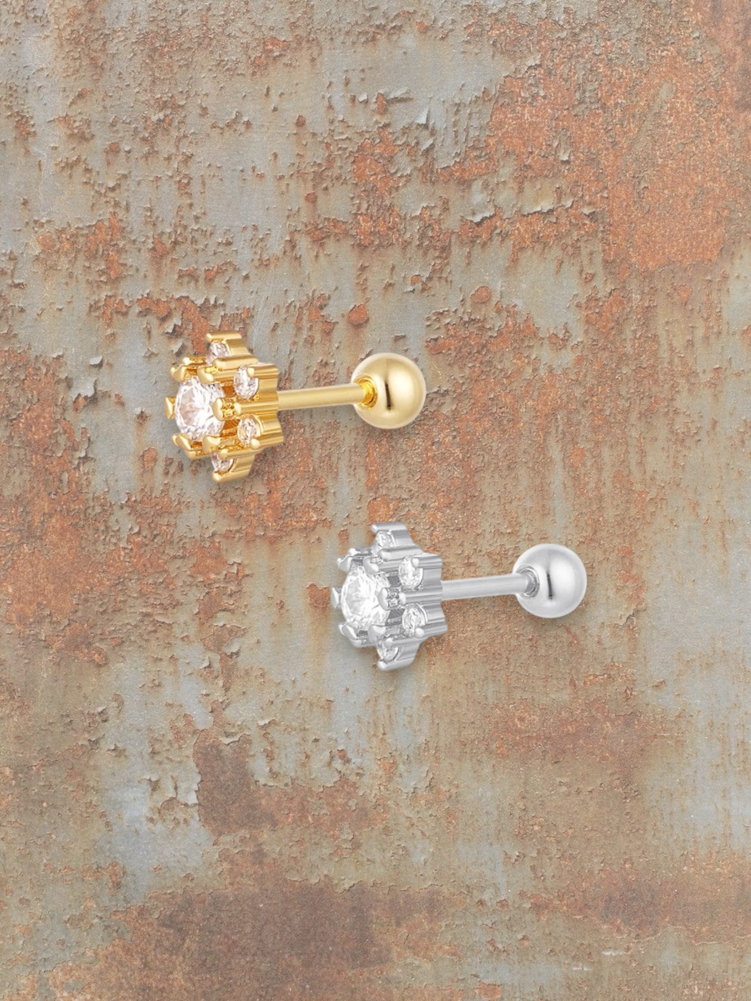 WILDSIDE silver and gold flower piercings with clear stones. Elegant, durable, and comfortable for everyday or special occasions.