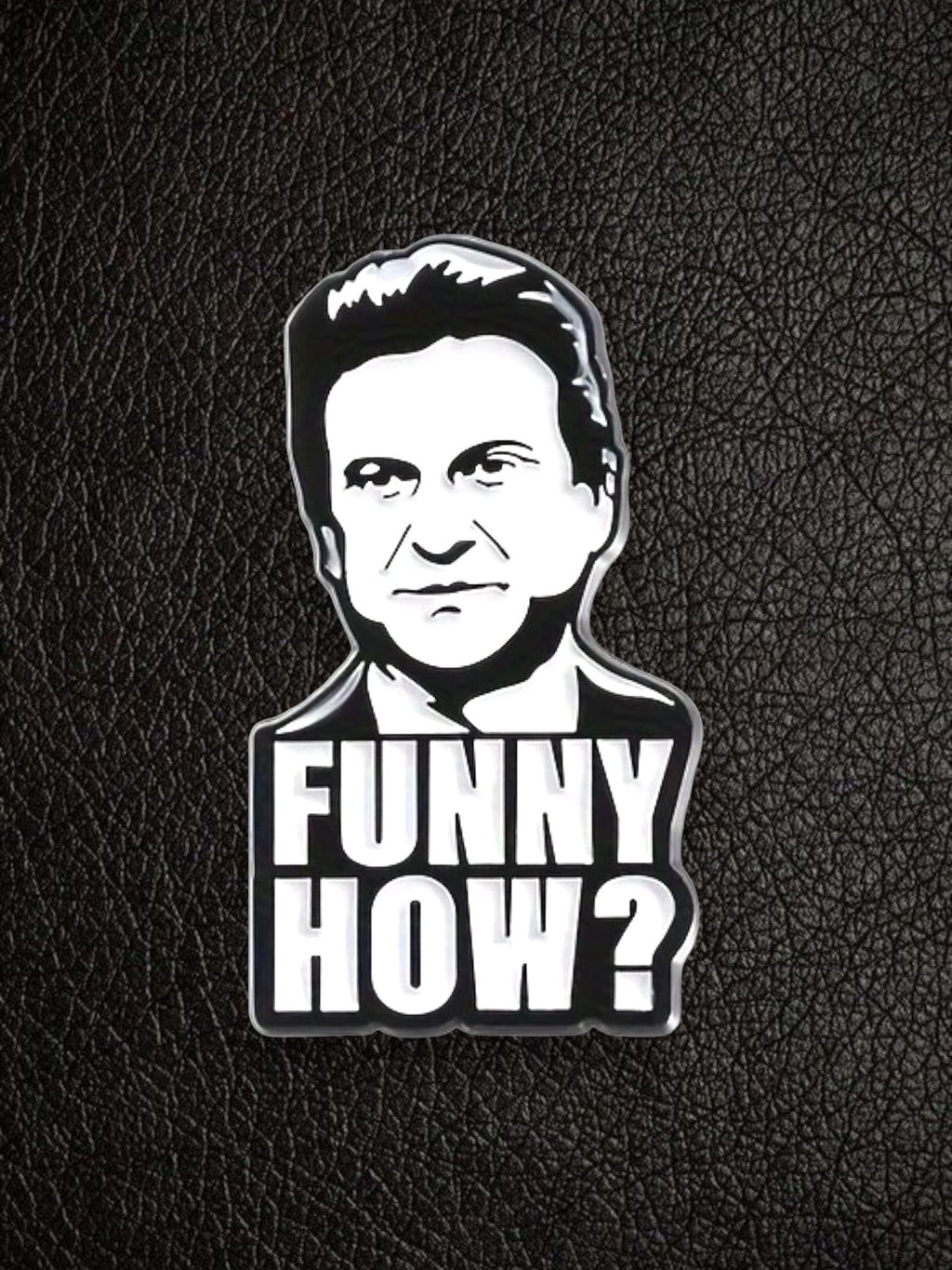 WILDSIDE black and white enamel pin featuring a portrait of a comedian with the text "FUNNY HOW?"