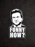WILDSIDE black and white enamel pin featuring a portrait of a comedian with the text "FUNNY HOW?"