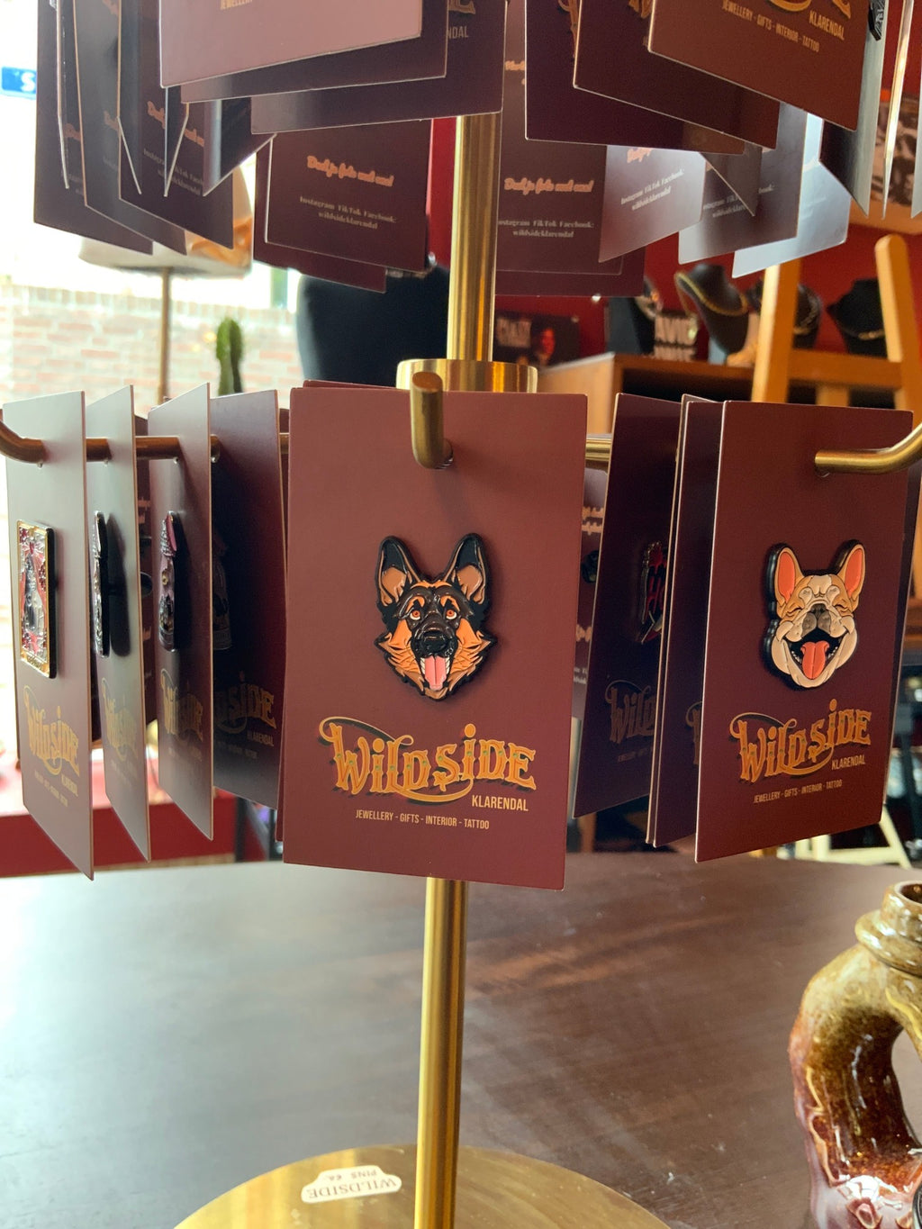 WILDSIDE enamel dog pin featuring a German Shepherd with its tongue out, attached to a display card.