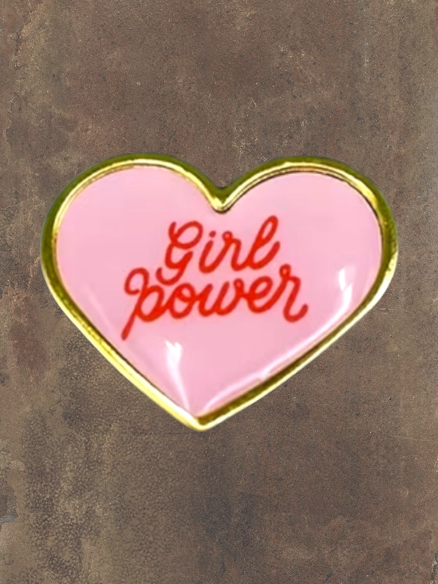 WILDSIDE pink heart-shaped enamel pin with red "Girl power" text and gold trim.