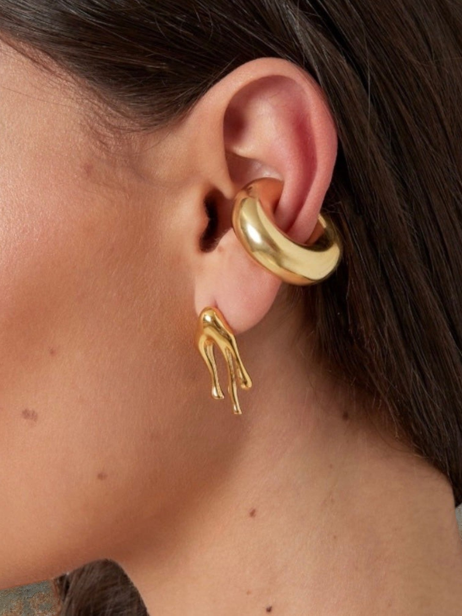 WILDSIDE gold-tone metal ear cuff with a smooth, rounded design, no piercing needed.