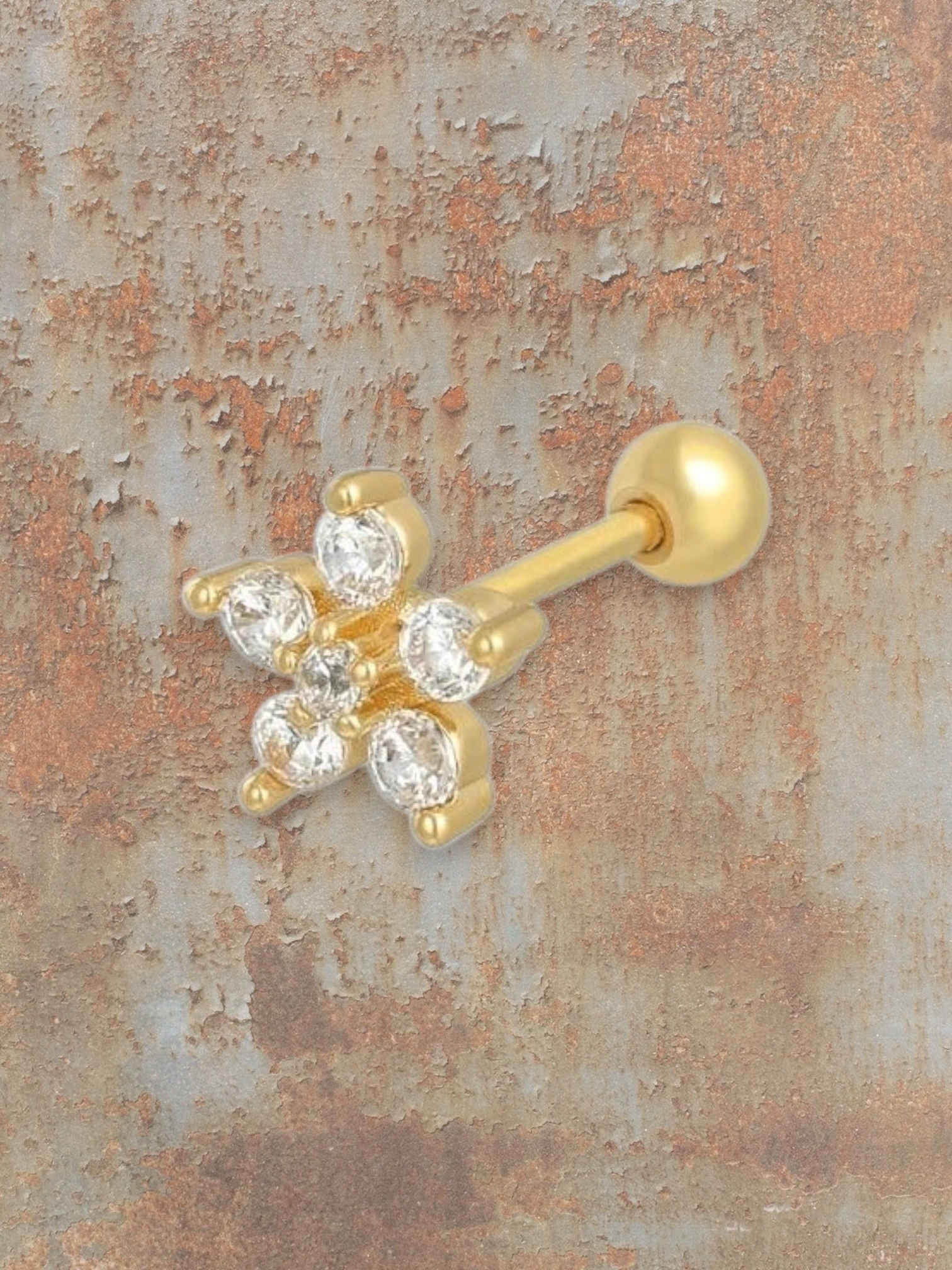 WILDSIDE gold flower piercing with clear stones. Elegant and dainty design for cartilage or lobe.