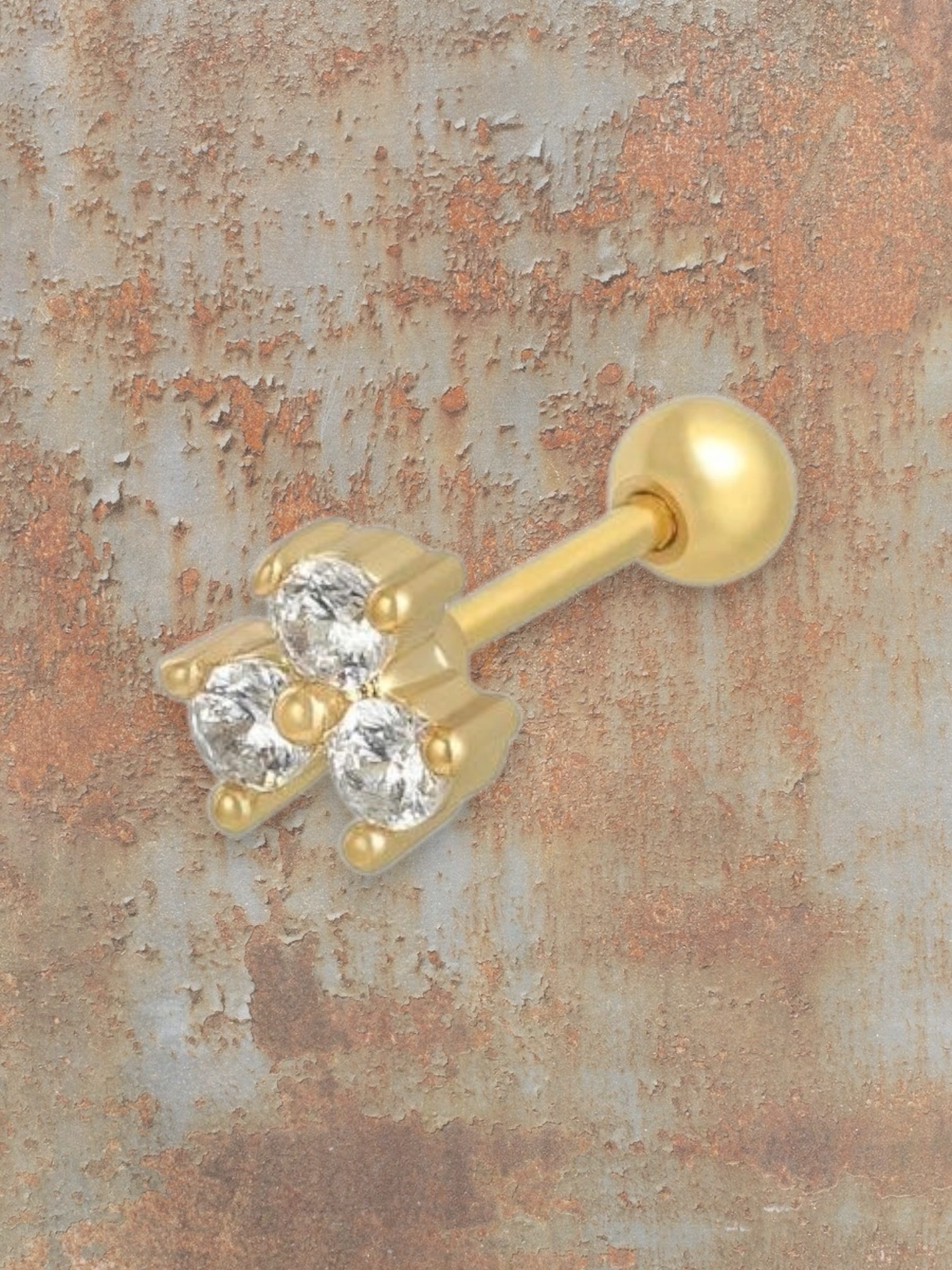 WILDSIDE gold labret piercing with three clear cubic zirconia stones and a ball end.