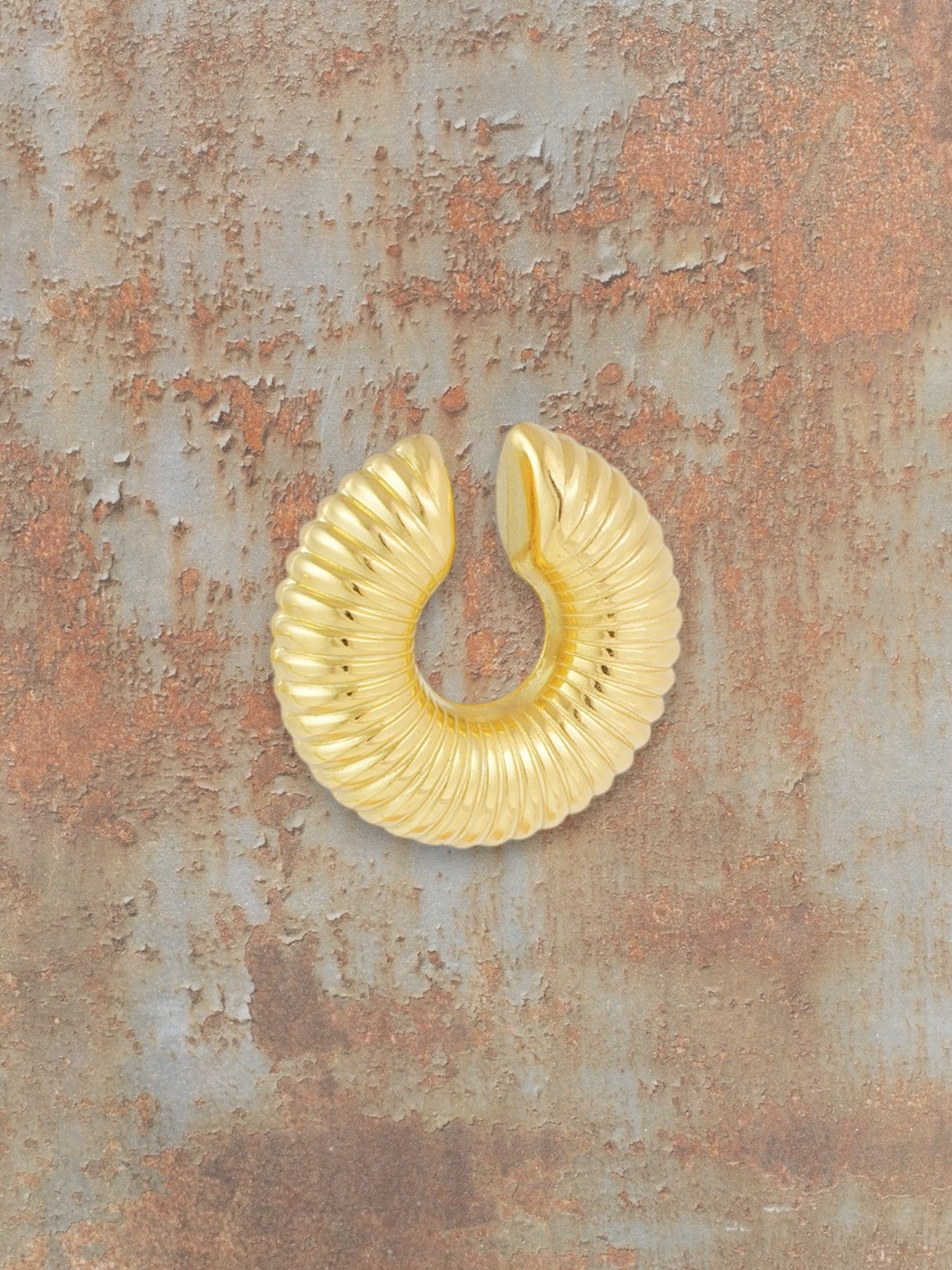 WILDSIDE gold ribbed statement ear cuff, no piercing required, timeless design.