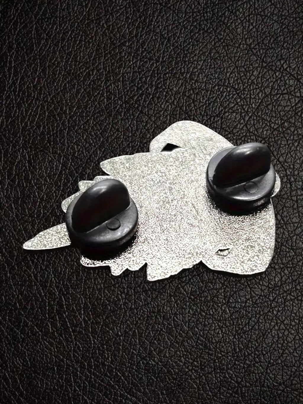 WILDSIDE Guns N Roses enamel pin with silver metal backing and two black clutch fasteners.