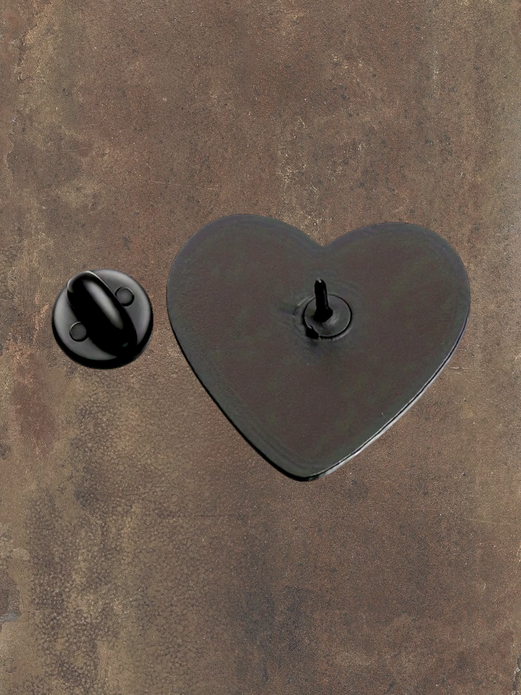 WILDSIDE black and white heart hands enamel pin with glossy finish. Features a pin backing.