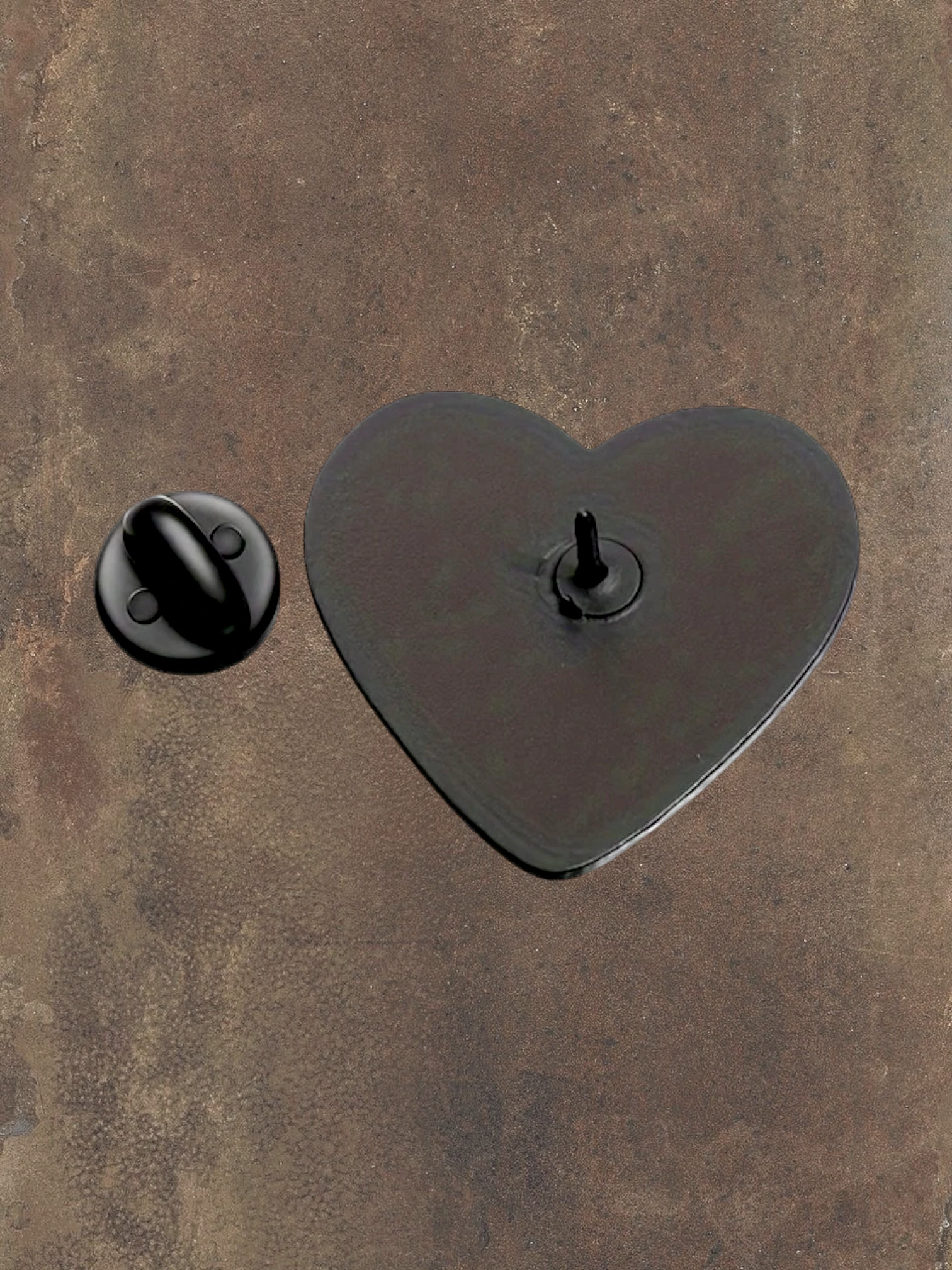 WILDSIDE black and white heart hands enamel pin with glossy finish. Features a pin backing.