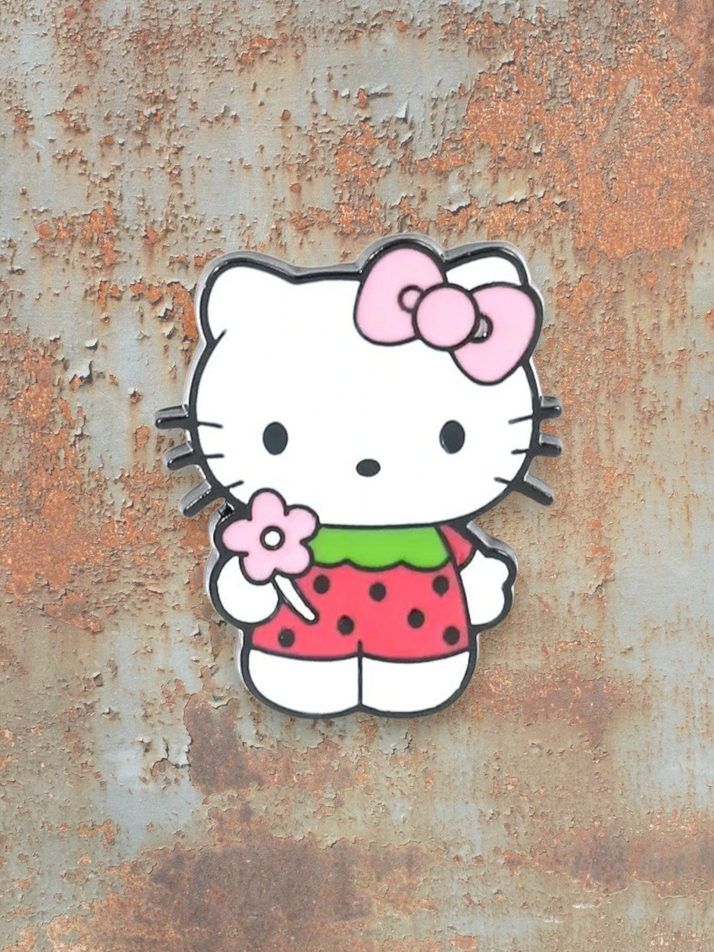 WILDSIDE Hello Kitty strawberry pin with pink bow and flower, red polka dot dress.