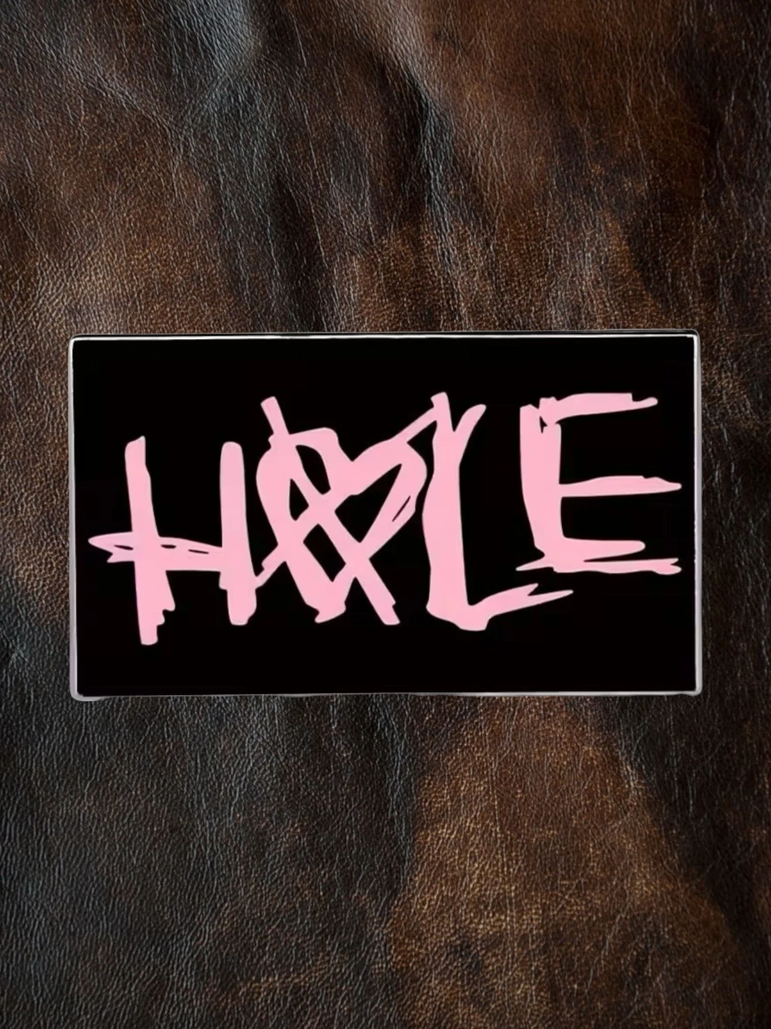 WILDSIDE black rectangular pin with pink 'Hole' band logo and heart detail.