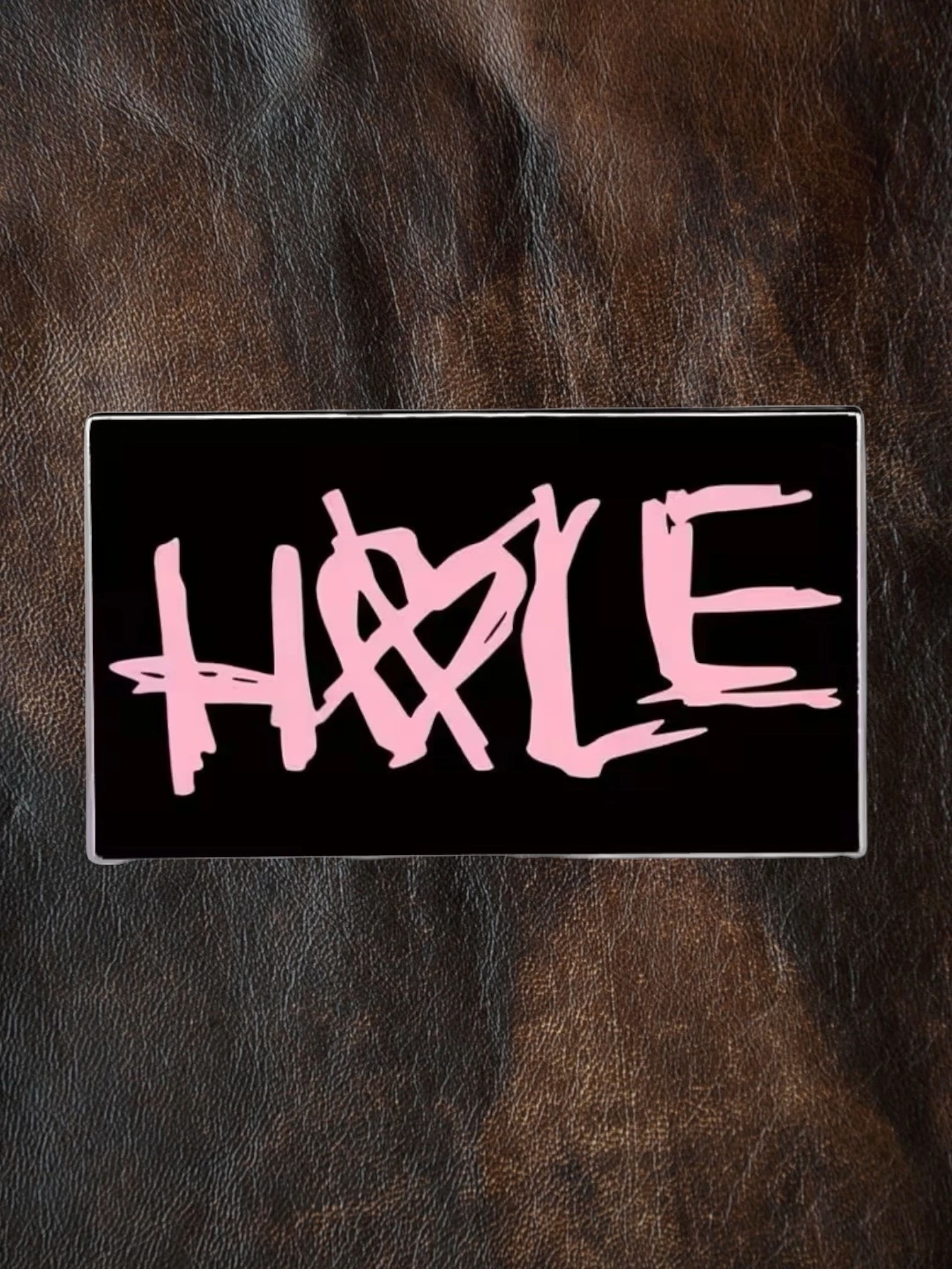 WILDSIDE black rectangular pin with pink 'Hole' text and a heart symbol.