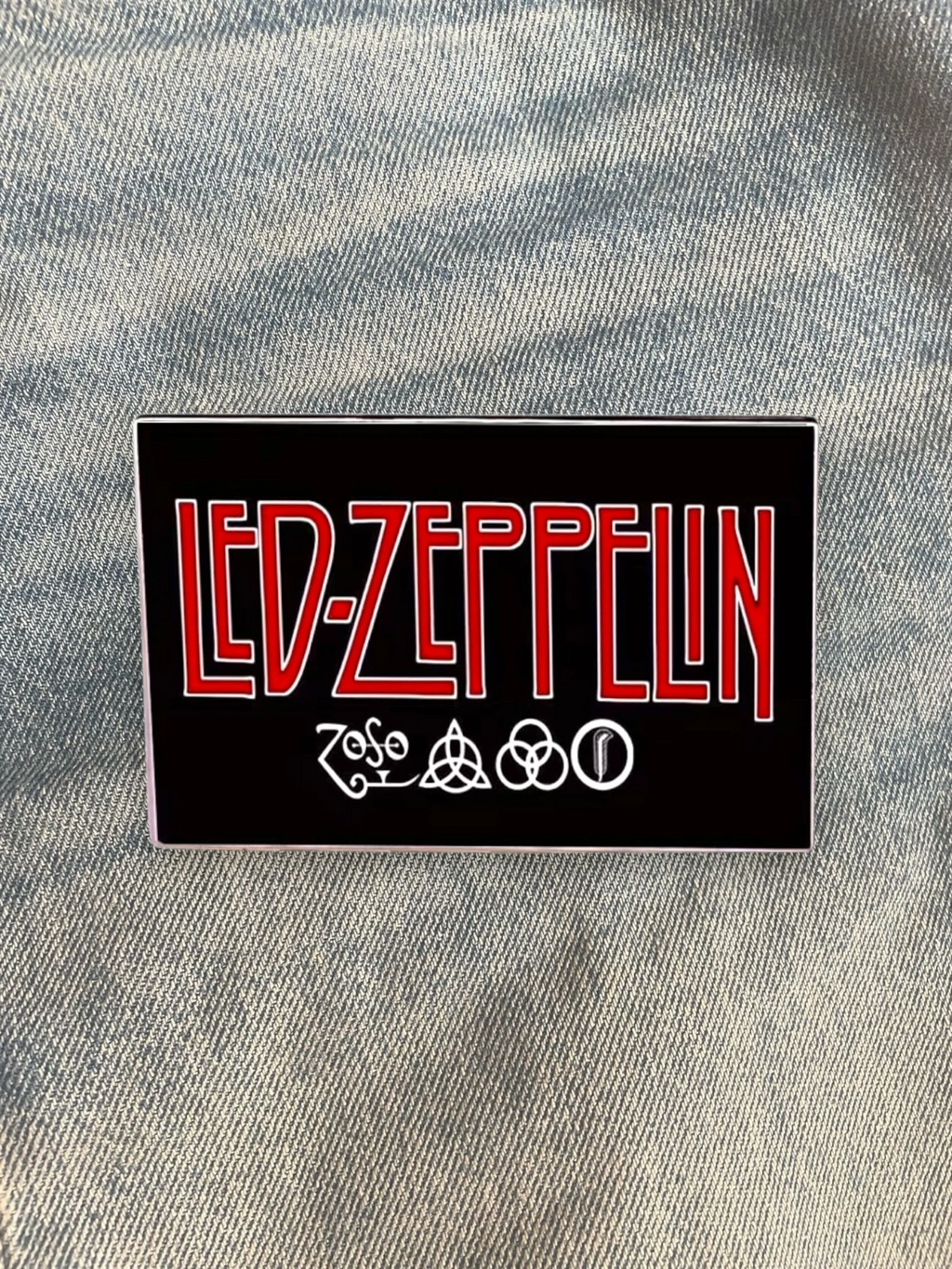 WILDSIDE Led Zeppelin band logo pin with red lettering and four symbols on a black background.
