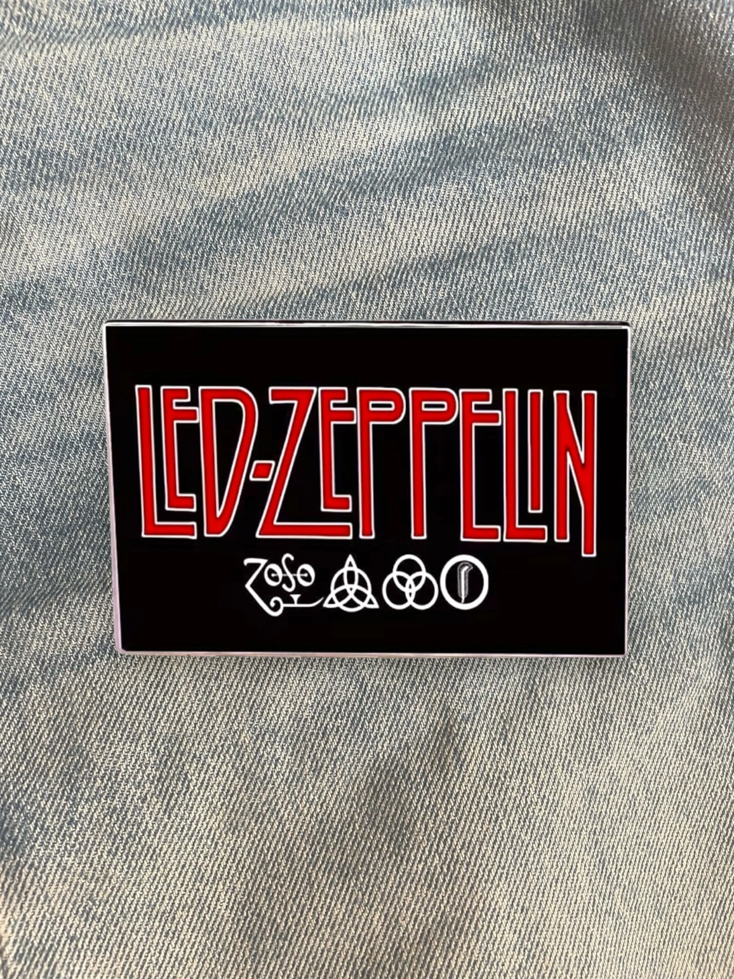 WILDSIDE Led Zeppelin band logo pin with red lettering and four symbols on a black background.
